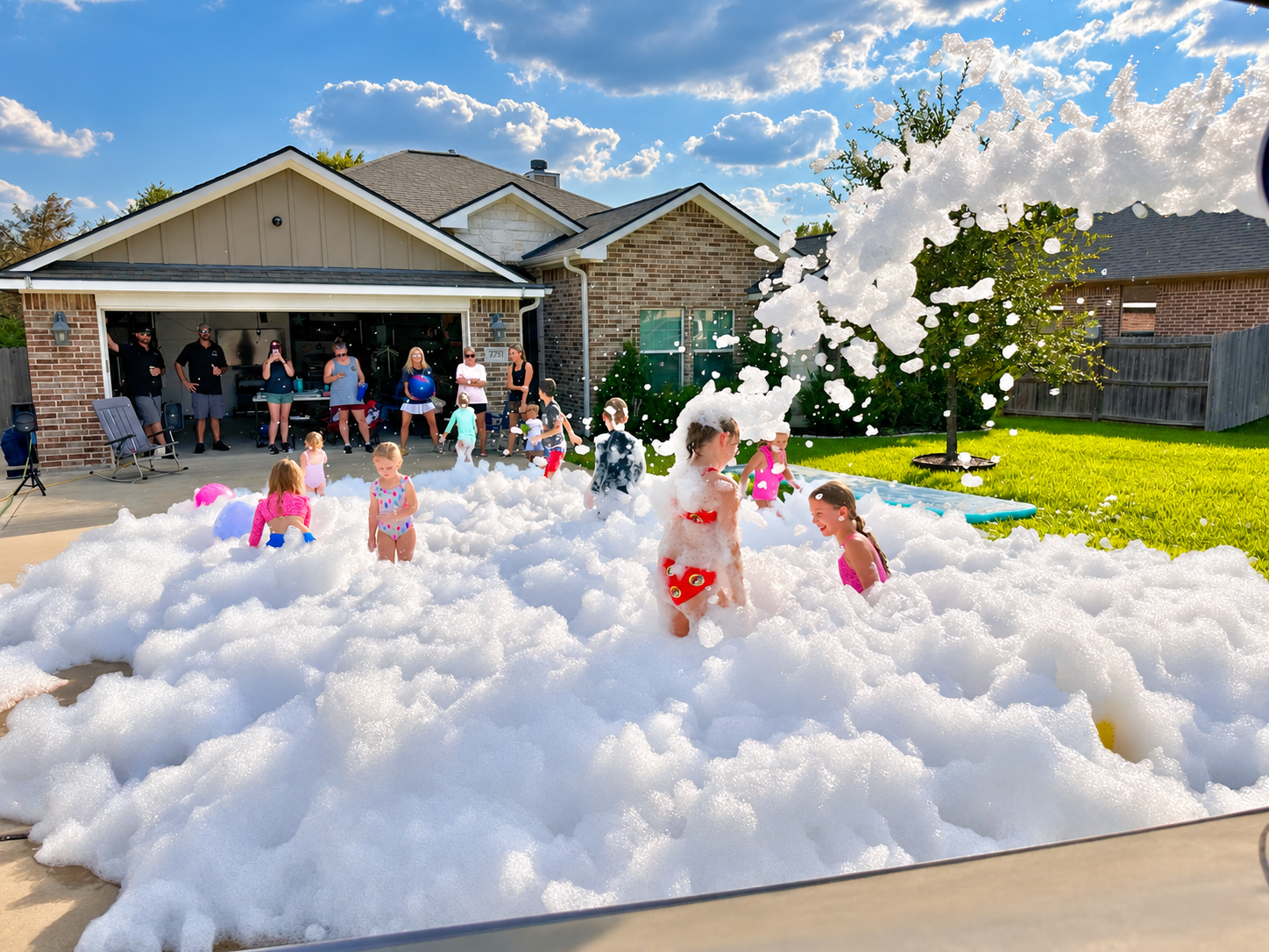Children enjoying a sunny Foam Mania party in Central Texas